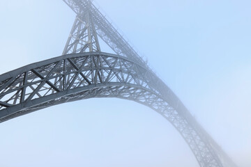 Fototapeta na wymiar Porto iron bridge in the mist