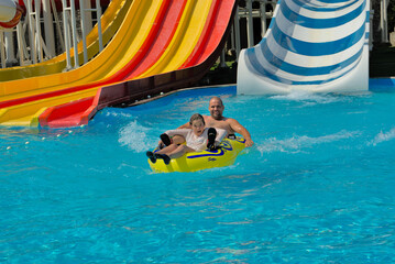 Water park for adults and children with water slides and pools for entertainment and outdoor...