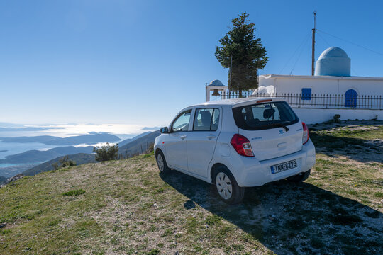 Lefkada island. Greece-10.18.2022. A Suzuki Celerio on top of a mountain with an exquisite view of the coastline and islands.