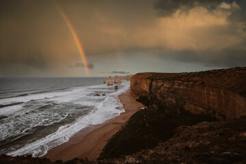 Stunning rainbow over the Twelve Apostles on the Great Ocean Road, Victoria, Australia. 