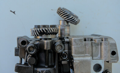 Broken gear on the balancer shafts and oil pump drive in a car engine