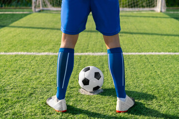 football player set ball football on grass at freekick point before shoot or kick to win a score in international league football match