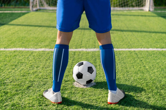 football player set ball football on grass at freekick point before shoot or kick to win a score in international league football match