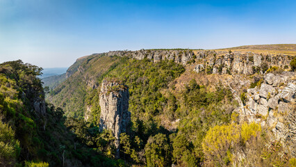 Fototapeta na wymiar The Pinnacle Rock, a tower-like freestanding quartzite buttress which rises 30 m above the dense indigenous forest in Mpumalanga, South Africa.