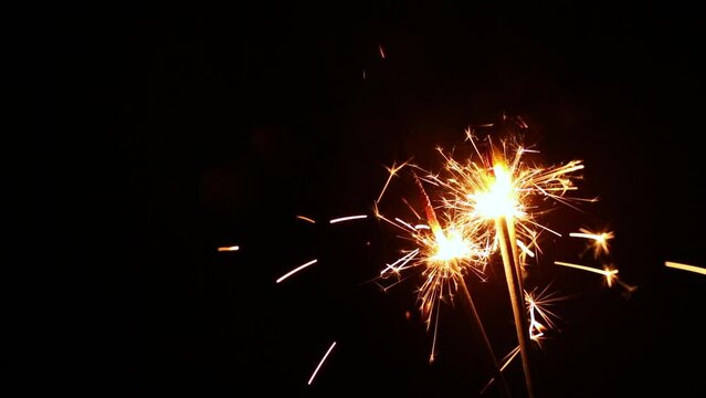 New year or Christmas party Sparker on black background. Bengal fire burning