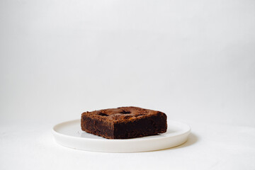 Chocolate brownie on white background.