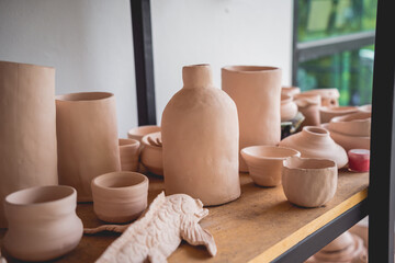 Fototapeta na wymiar Ceramic vase on the table at the workshop