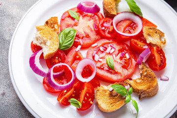 tomato salad panzanella bread, onion vegetable meal food snack on the table copy space food background  top