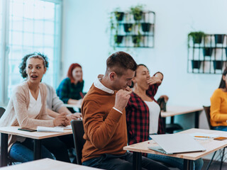 A group of young tired people gathered for a presentation of the work on the board
