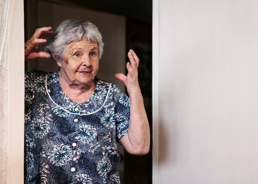 Ninety two year old white caucasian senior woman at home gesticulates with hands.