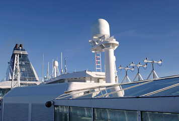 VSAT terminal, satellite internet connection, navigation equipment installed on the ship's superstructure. Telecommunications and Navigation equipment on the upper decks of a modern cruise ship.