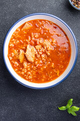 kharcho red tomato soup meat, rice meal food snack on the table copy space food background 