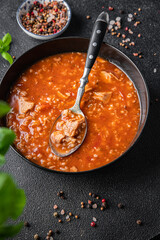 kharcho red tomato soup meat, rice meal food snack on the table copy space food background 