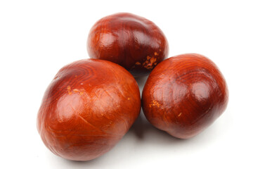 closeup of chestnuts isolated on white background with some real shadows.
