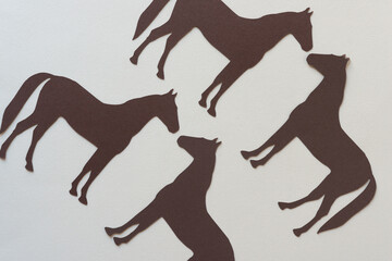 silhouette of paper horses