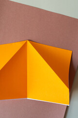 light weight neon orange craft paper on brown construction paper
