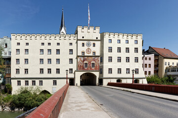 Fototapeta na wymiar Gate to bavarian city Wasserburg am Inn. Bridge above river Inn.
