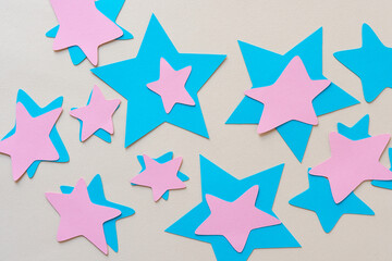 blue and pink paper stars on beige