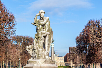 Statue of a standing man resting his arm above the head of a seated woman, at the Jardin des Grands...