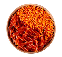 Fusilli made from red lentils, pile uncooked pasta in clay pot isolated on white, top view 