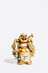 Isolated Golden budai hotei is a Chinese folkloric deity. Name means "Cloth Sack", a laughing buddha on the sand Note to the reviewer: Budai, Hotei, Pu-Tai is the right words, there is such a words