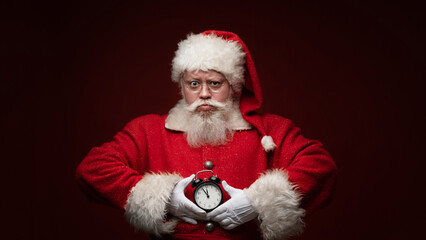 Santa claus with alarm clock