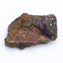 Natural stone chalcopyrite on a white background. Mineral of golden color on a white background