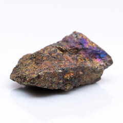 Natural stone chalcopyrite on a white background. Mineral of golden color on a white background