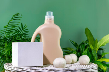 Natural laundry detergent mockup. Bottle of washing gel or fabric softener and box with detergent...
