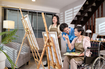 Group of Asian senior people are enjoy  painting at elderly healthcare center, elder group therapy concept.