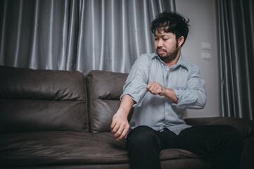 Fototapeta premium Asian handsome man stress from work overload,Tired male come back home after a lot of work from company,risk of depression