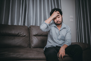 Fototapeta premium Asian handsome man stress from work overload,Tired male come back home after a lot of work from company,risk of depression