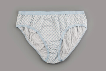 Female cotton panties on gray backgound
