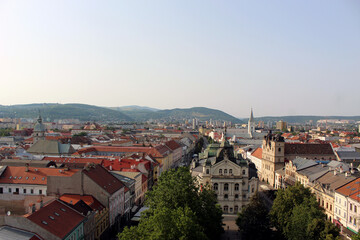 Fototapeta na wymiar Panoramic view of Kosice Old city from St. Elisabeth Cathedral, scenic daytime cityscape with streets, red tiled roofs of medieval buildings and blue cloudy sky, urban skyline, Slovakia (Slovensko)