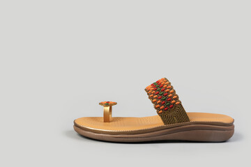Indian made Ladies Sandals on gray background