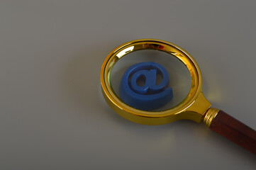 Magnifying glass and email address symbol. Email marketing and email communication concept.