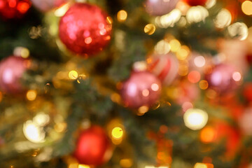 Beautiful holiday decorated room with Christmas tree and bright lights , out of focus shot for photo background. Blur christmas background