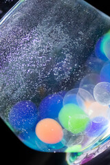 Colored balls in a glass with bokeh effect