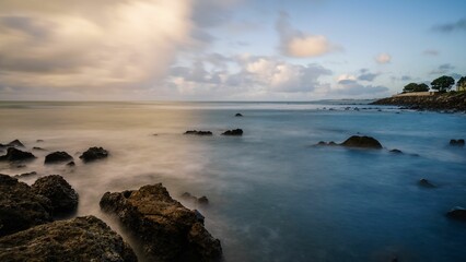 Scenic view of a beautiful beach against a vibrant sky on a summer day in New Zealand