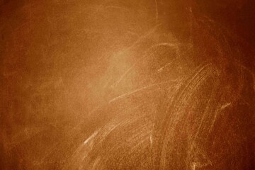 Chalk rubbed out on blackboard, orange or brown texture or background