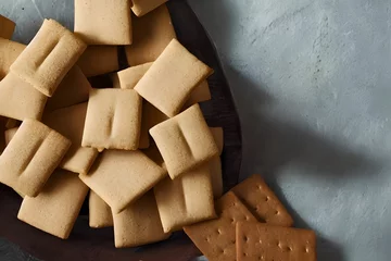 Foto op Canvas graham crackers, an american food item from the 1800s, a food ingredient © Omer Mendes/Wirestock Creators