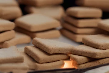 Zelfklevend Fotobehang graham crackers, an american food item from the 1800s, a food ingredient © Omer Mendes/Wirestock Creators