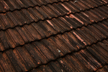 Background of red tiled roof. Red old roof tiles