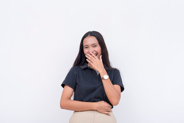 A young asian woman snickers from a joke. A happy and lighthearted scene. Isolated on a white...