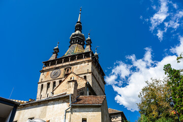 Fototapeta na wymiar Medieval fortified citadel of Sighisoara city and the famous Clock Tower