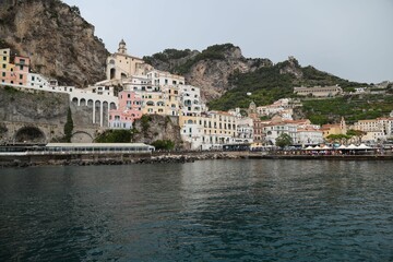 Fototapeta na wymiar Scenic view of the colorful buildings by the sea in Amalfi, Italy