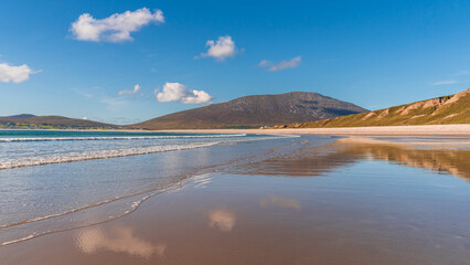 Empty beach on a sunny summer day at low tide.
Keel Beach on Achill Island in County Mayo, Ireland.
