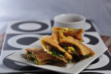 Martabak Telor or Martabak Telur. Savory pan-fried pastry stuffed with egg, meat and spices