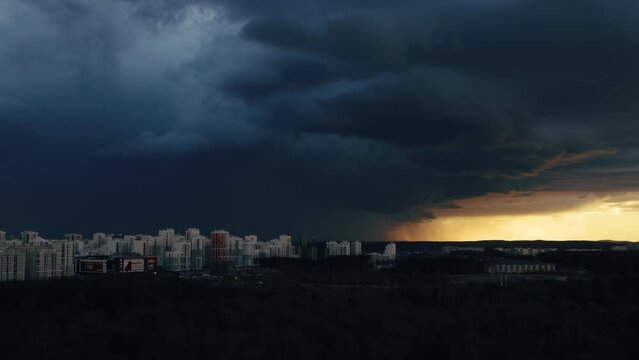 A shot of thunderclouds over a city
