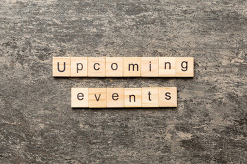 upcoming evente word written on wood block. upcoming evente text on table, concept